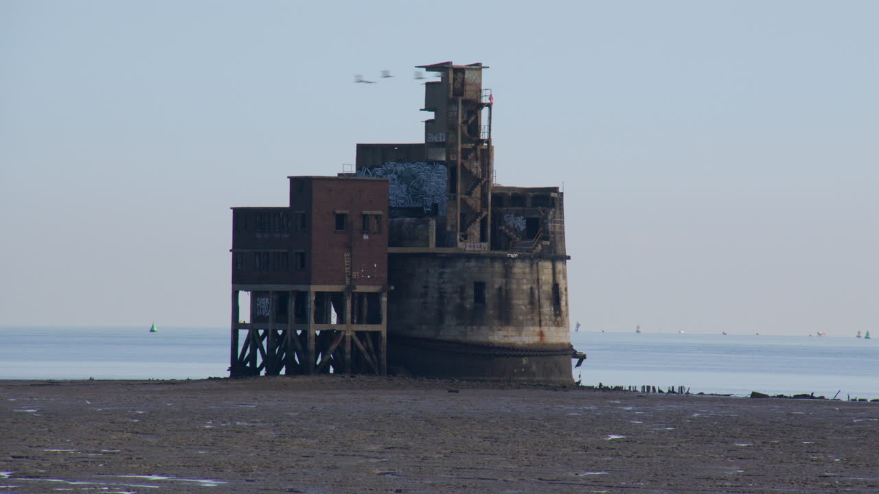 Wide shot looking at the South side of the grain battery tower at low tide
