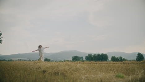 joyful woman running in field