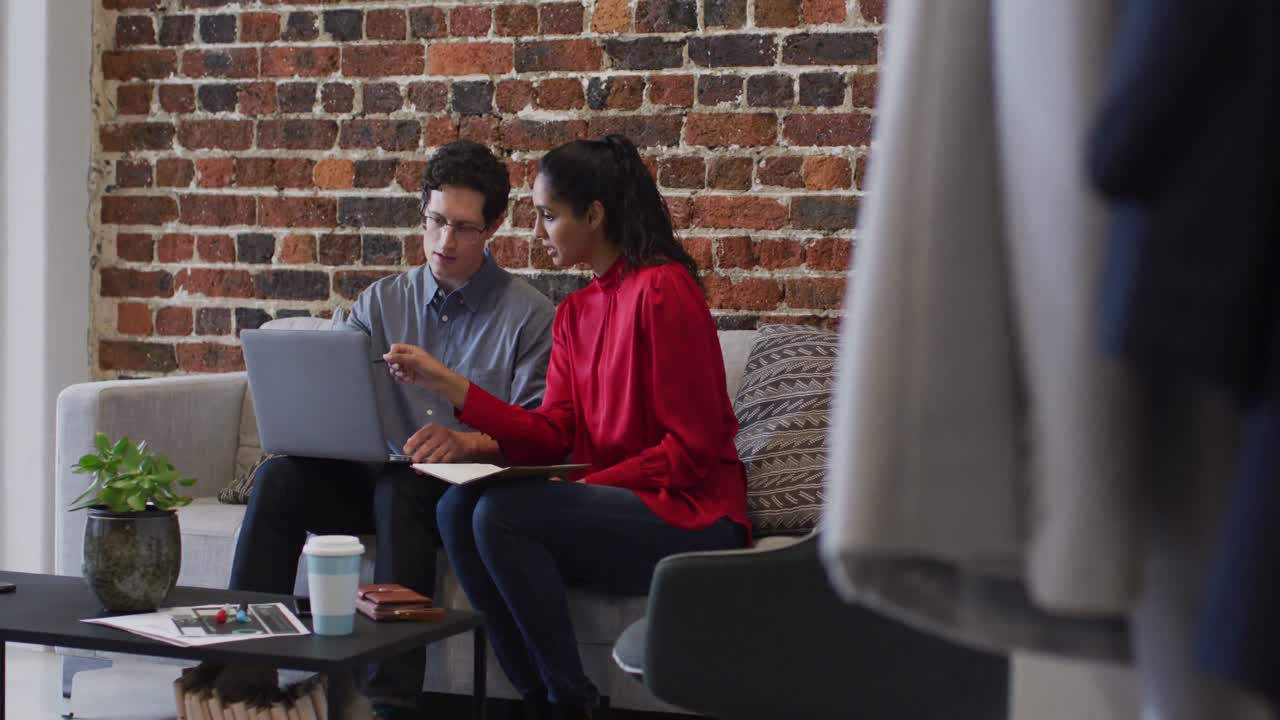 Man and woman working together in office
