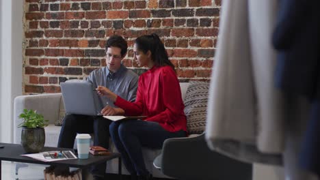 man and woman working together in office