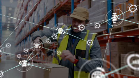 Handling-package-in-warehouse,-worker-with-logistics-network-animation-overlaid