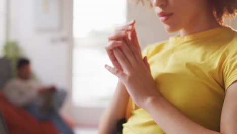 mixed race woman working on computer in creative office