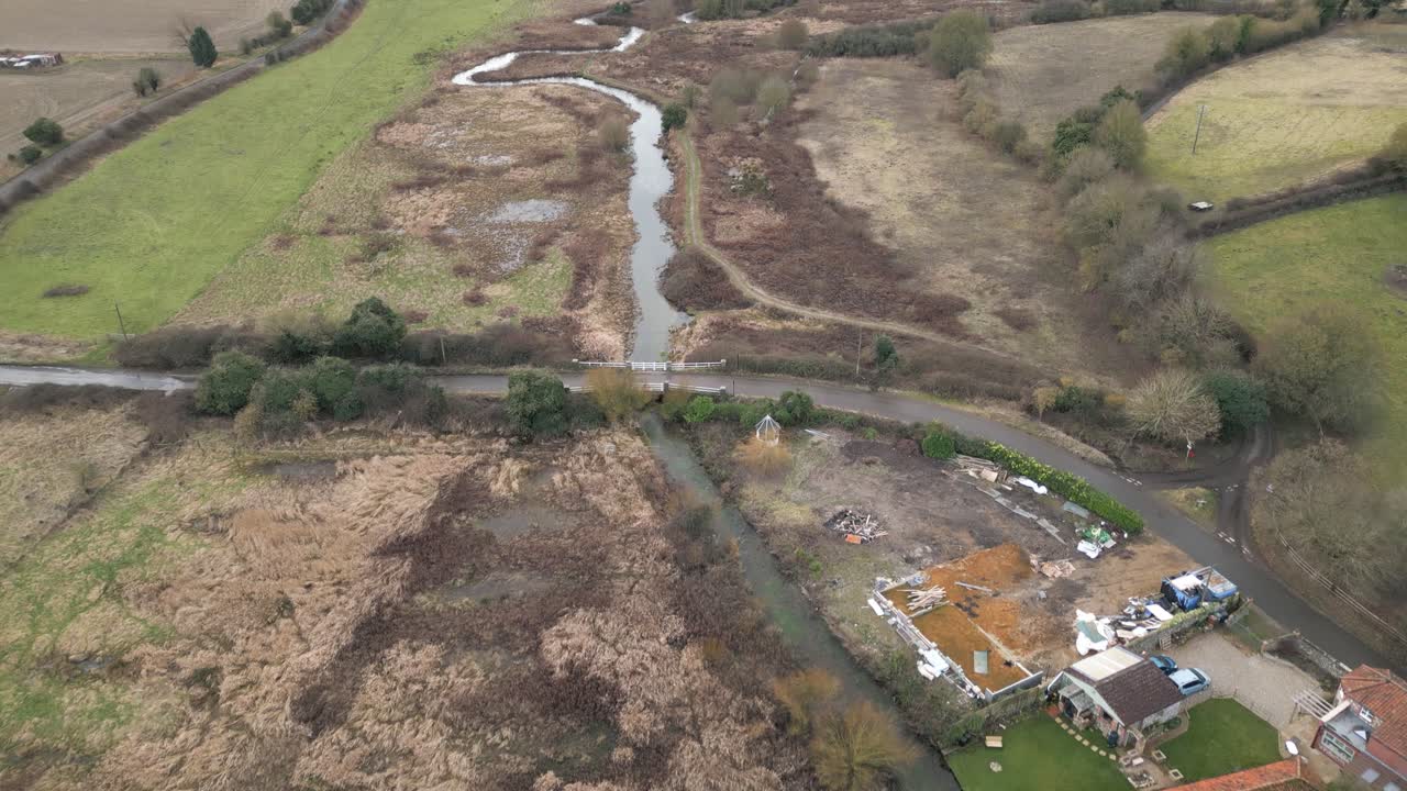 Aerial drone shot of small stream at Castle Acre Priory and Bailey Gate, captured in Norwich 4K 25fps