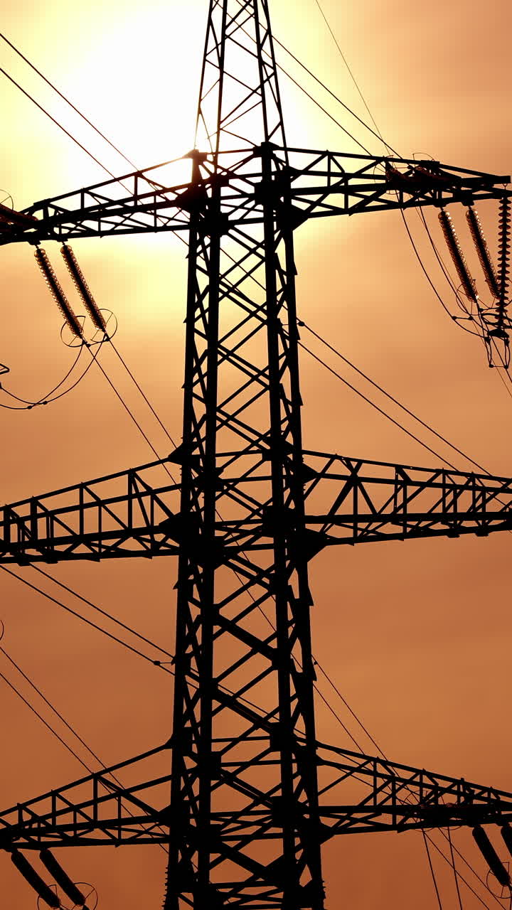 High power electricity poles. View of high voltage electrical transmission tower. Vertical video