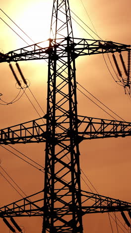 high power electricity poles. view of high voltage electrical transmission tower. vertical video