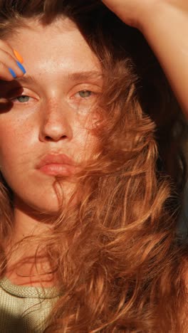 close-up portrait of a young woman with curly hair