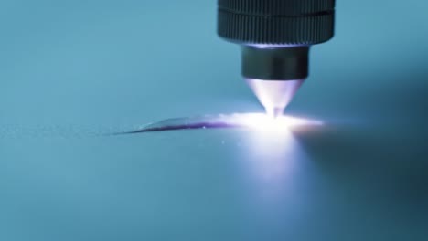 laser technology is used to cut materials with precision in a clean, well-lit manufacturing space. the powerful beam creates sharp edges and intricate designs effortlessly.