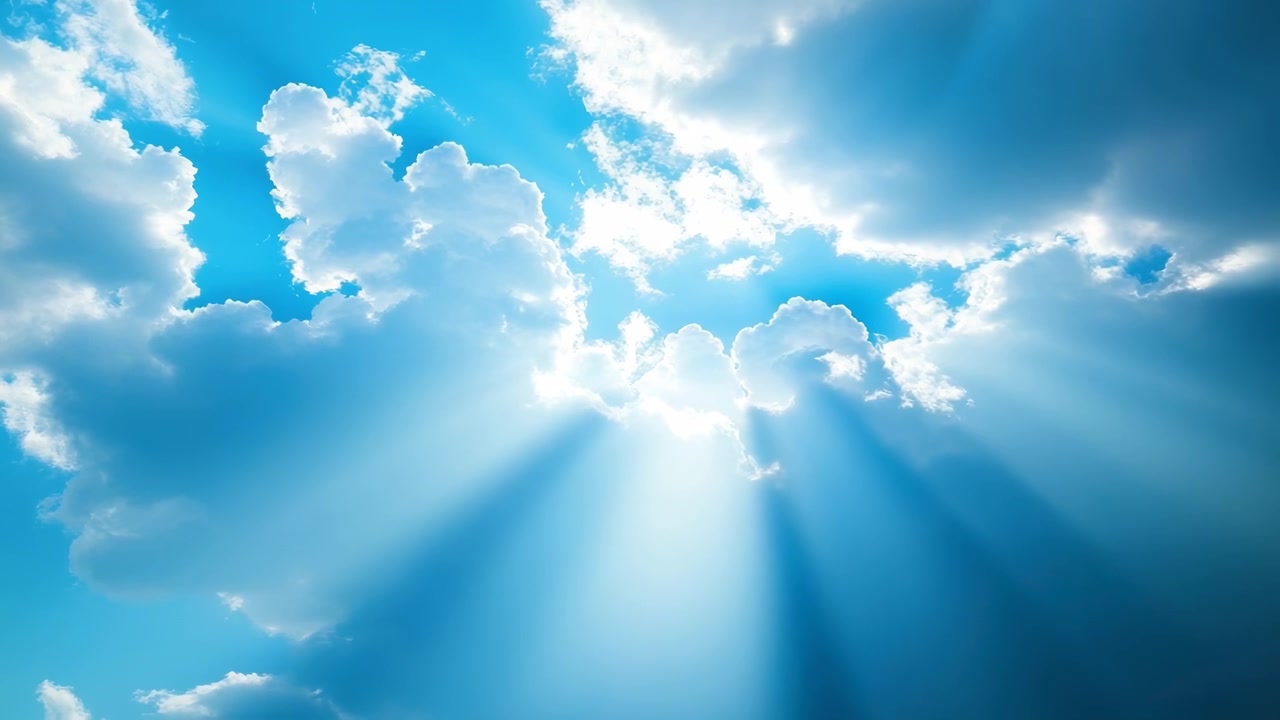 Bright Sun Rays Piercing Through Clouds in a Clear Blue Sky