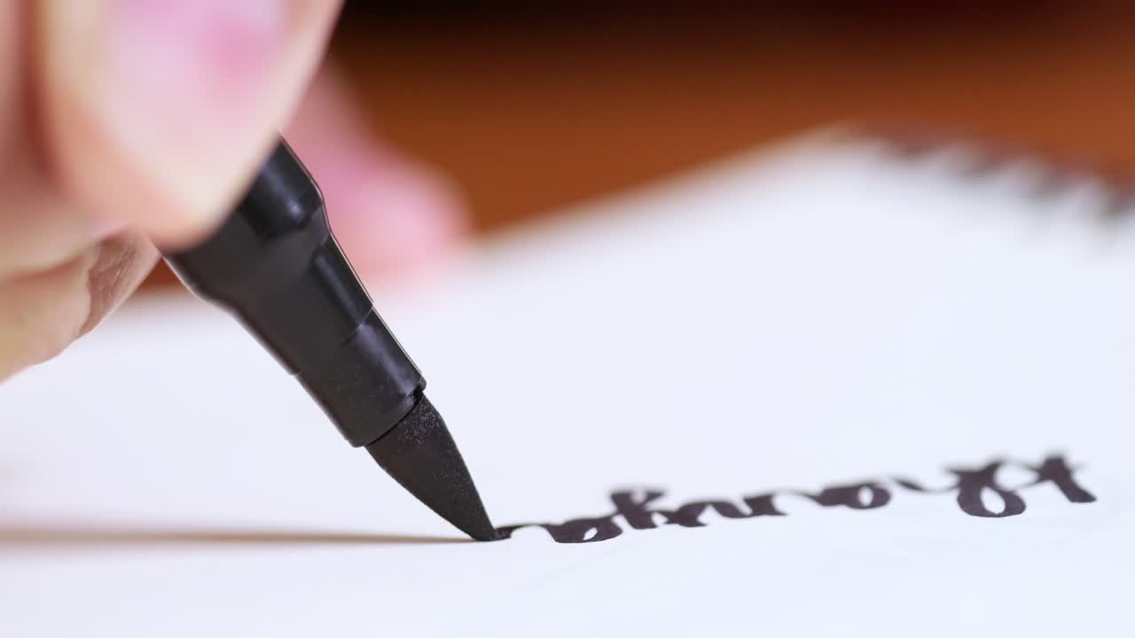 Writing in progress handwriting practice session home office educational content indoor close-up skill development