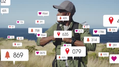 animation of social media icons over african american man tightening his backpack while hiking