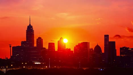 el amanecer sobre el horizonte de filadelfia baña la ciudad en un caloroso resplandor, destacando su impresionante arquitectura y paisaje urbano.