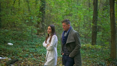 couple walking in the forest