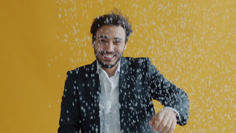 man celebrating with confetti