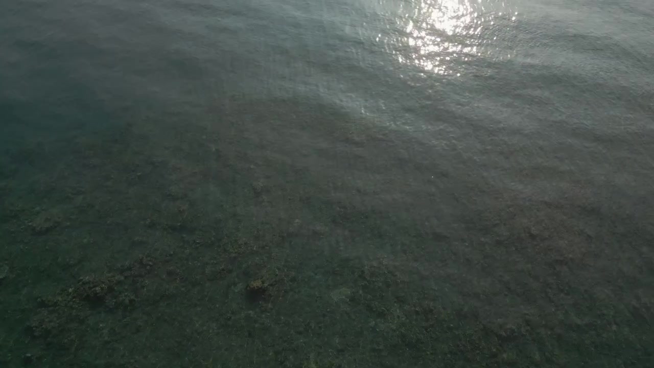 Blue Reef Water In The Morning Sunlight Buleleng North Bali Indonesia Drone Tracking Over Surface 4K 60FPS