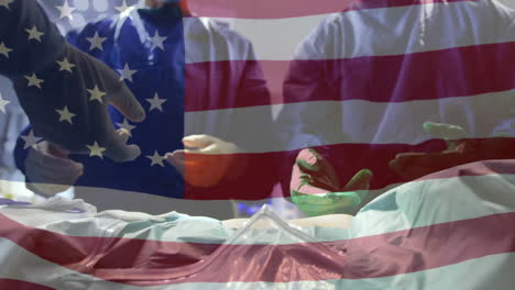 animación de la bandera de los estados unidos de américa ondeando sobre los cirujanos en el quirófano