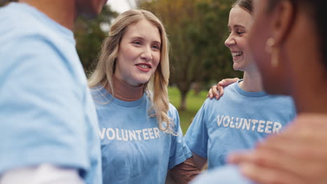 group of volunteers smiling and talking together