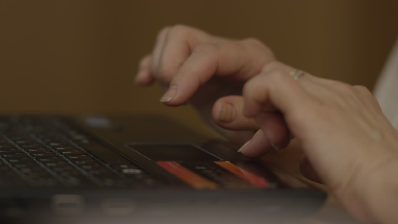 Woman Typing on Laptop