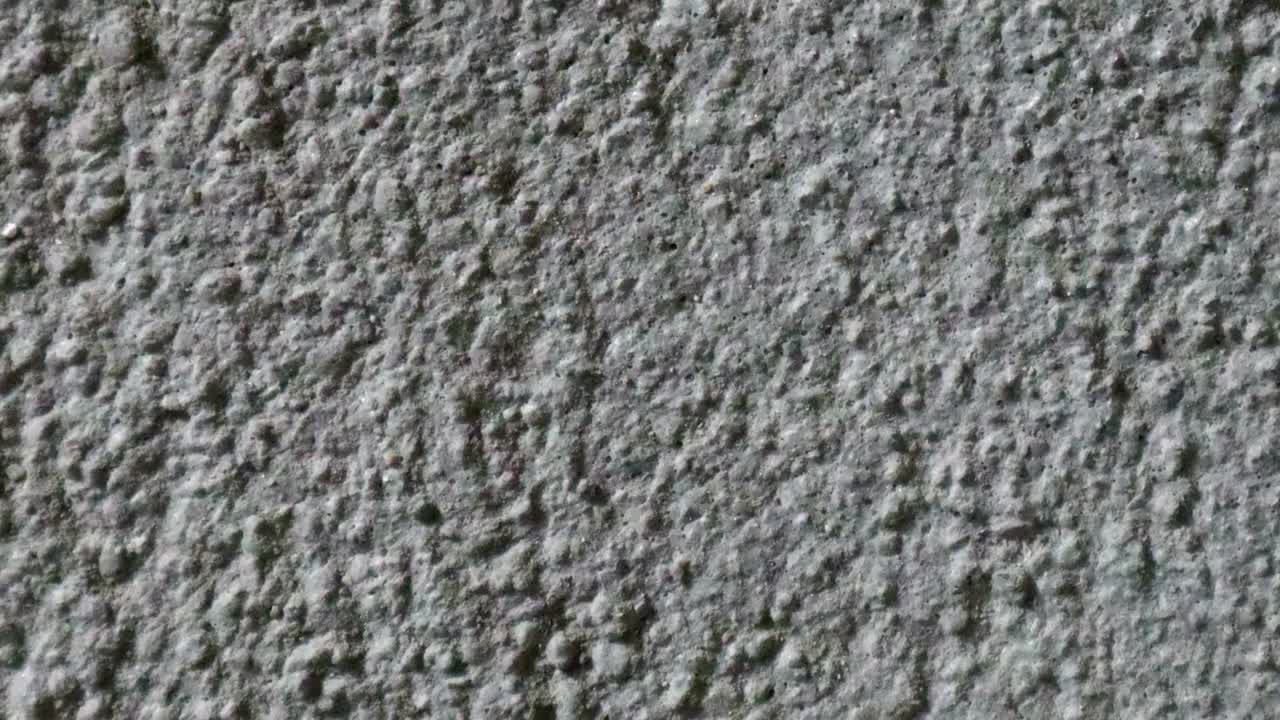 stop motion animación de fondo de textura de hormigón o útil para viejos efectos de películas utilizando la herramienta de opacidad o luma mate