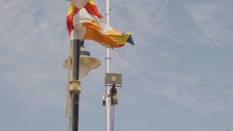 close up of lamppost with flag in mumbai india