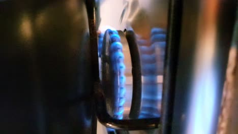 close up of a gas cooker blue flame burning