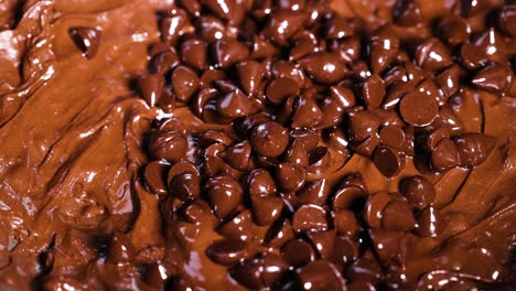 chocolate chips being added to brownie batter