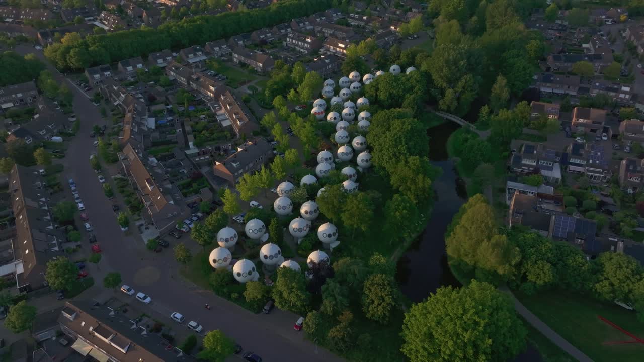 Side panning shot of Bolwoningen, also known as Dome Houses 's-Hertogenbosch, aerial