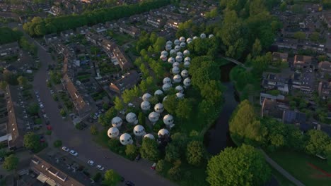 Side panning shot of Bolwoningen, also known as Dome Houses &#039;s-Hertogenbosch, aerial