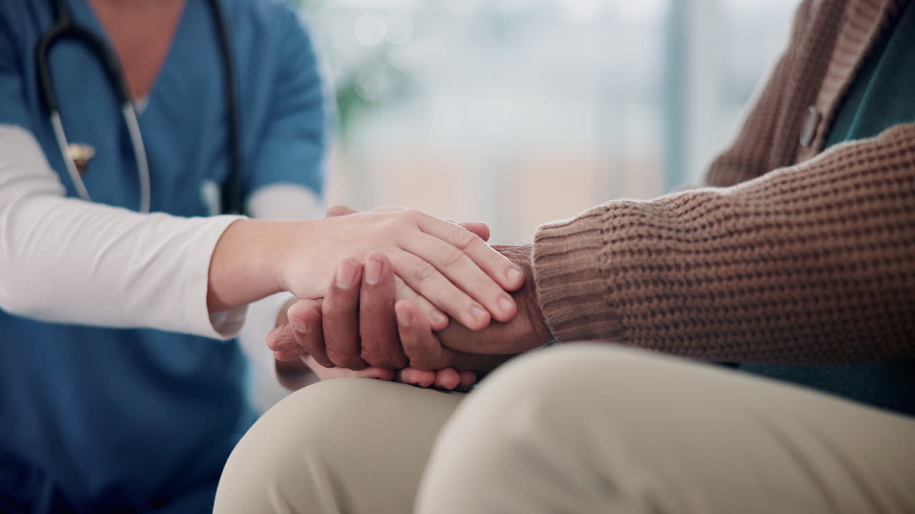 Nurse providing care and support to elderly patient