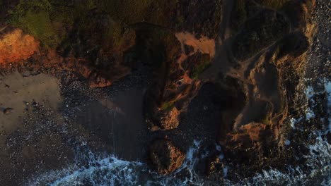 birds eye view drone footage descending on pescadero state beach in california