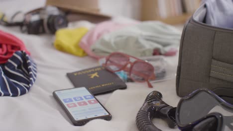 close up of open suitcase on bed at home being packed for summer holiday 5