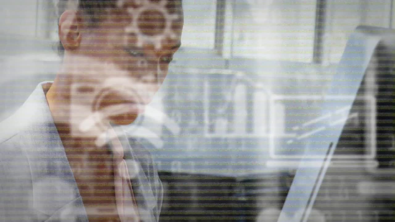 Animation of network of digital icons over businesswoman using computer