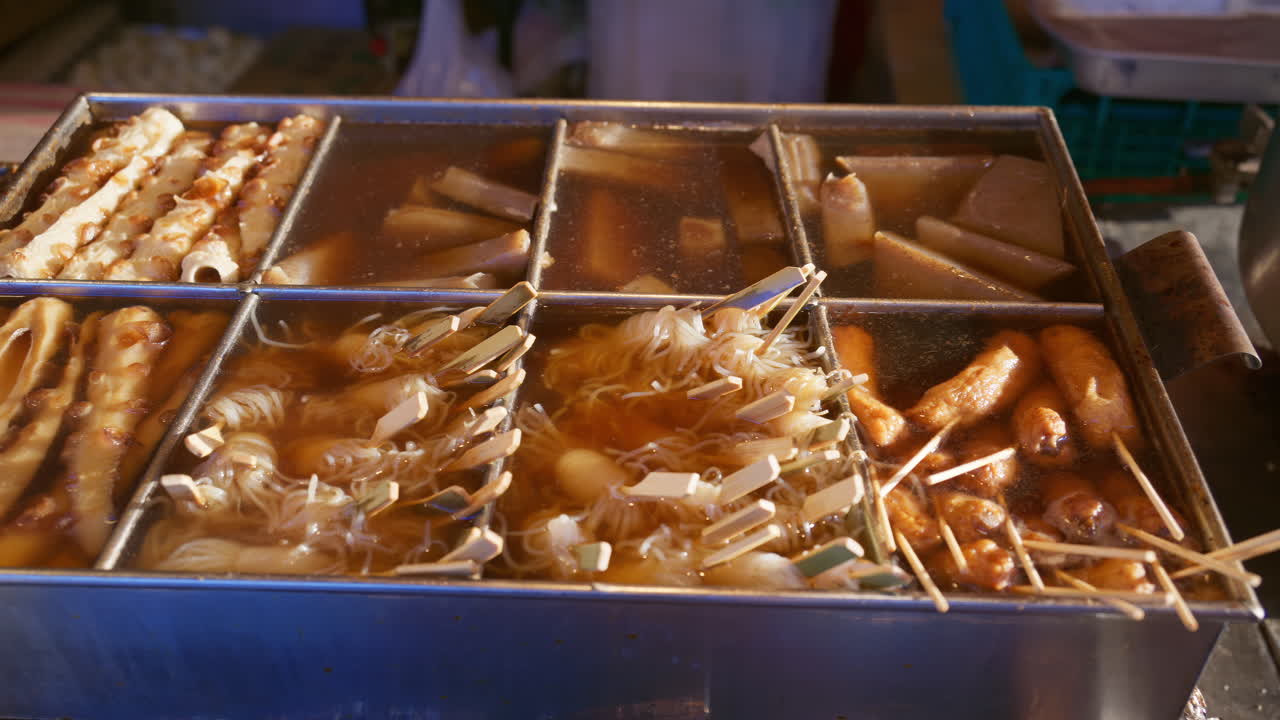 Close up of traditional Japanese oden stall at a street food market, in Kyoto, Japan