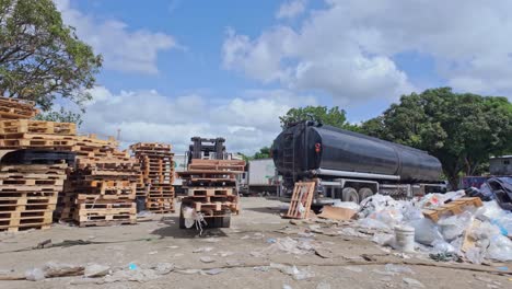 efficient handling of recycled pallets: forklift operations on a sunny day