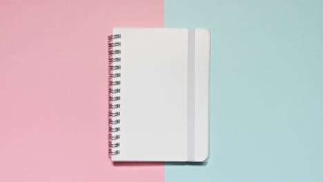 stop motion notebook opens on a pink and blue split set with matching stationery