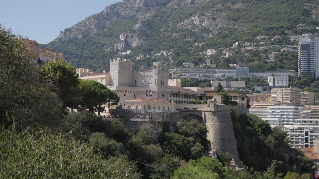Establishing shot of the Prince's Palace of Monaco on Le Rocher. Historic royal residence and fortress overlooking the Mediterranean Sea and Monte Carlo