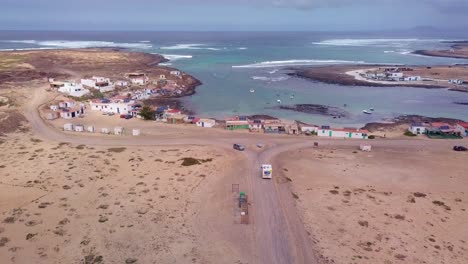 aerial view of coastal village by the ocean
