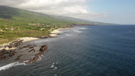 drone flight over the ocean and rugged coastline of the trois bassins area on reunion island