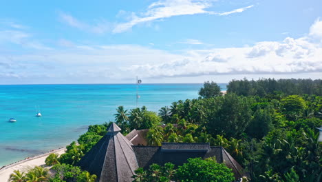 Aerial-drone-view-of-Denis-Private-Island-in-the-Seychelles,-Indian-Ocean