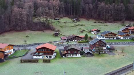 Switzerland-Grindelwald-cottage-view-in-winter-4K-drone-shot