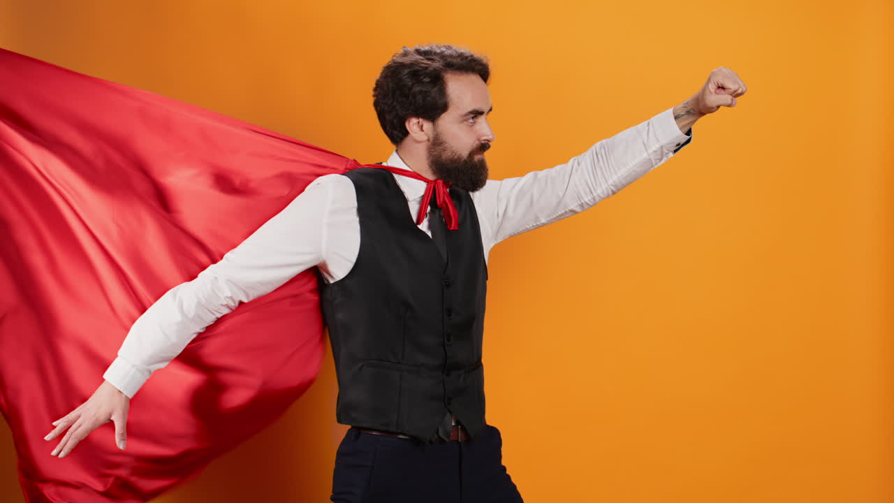 Confident waiter with red hero cape