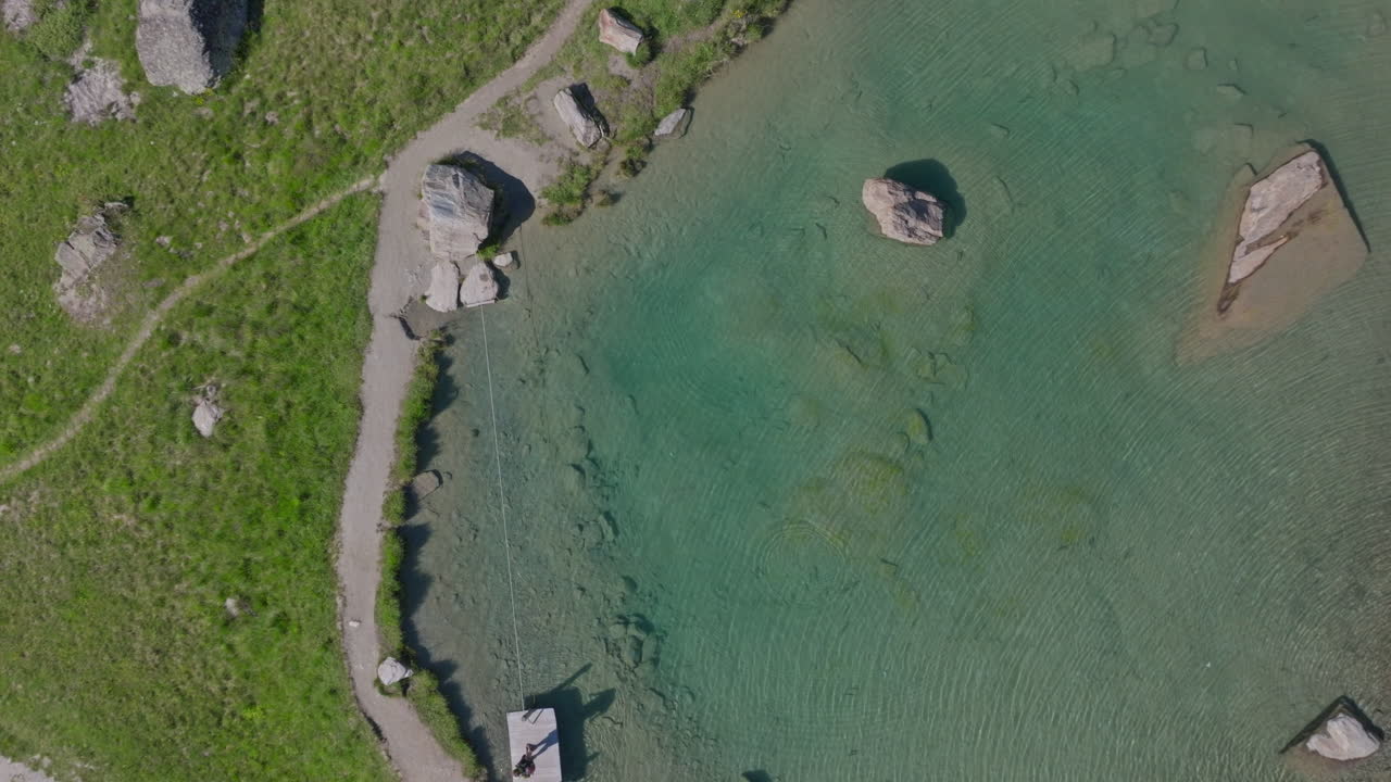Two hikers explore Saas-Fee, Saas-Balen, and the Saas-Almagell dam, passing waterfalls, marmots, and alpine peaks in a breathtaking high-mountain landscape.