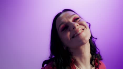 woman in a red dress against purple background