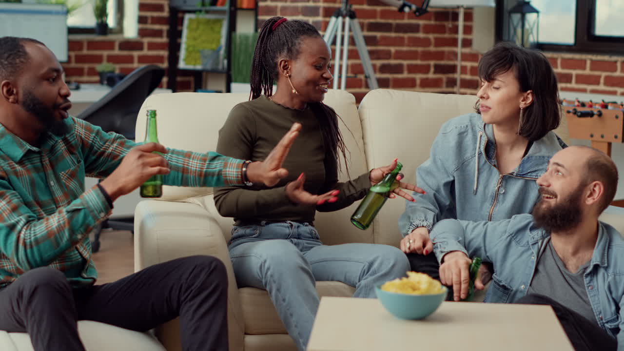 Happy people laughing and telling funny story at party gathering