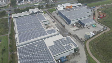 flying over industrial rooftop filled with solar panels