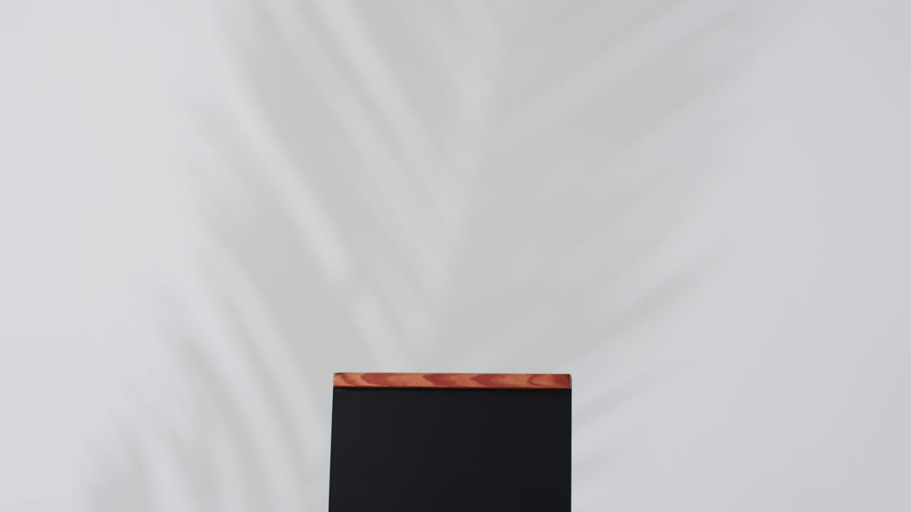 Video of blackboard sign on wooden stand with copy space on white background