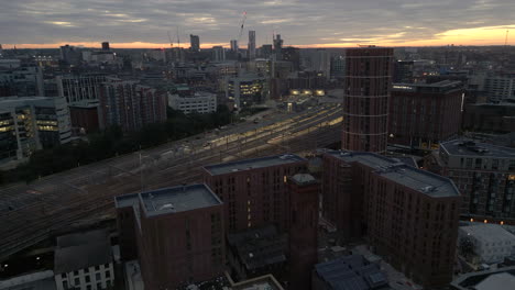 Establshing-Aerial-Drone-Shot-Over-Leeds-Station-and-City-Centre-in-Low-Light-Before-Sunrise