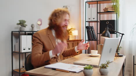 business man working on laptop shocked by sudden victory game winning lottery good career news mail