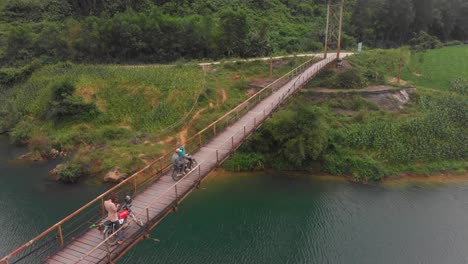 old suspension bridge over con river at phong nha at vietnam, aerial