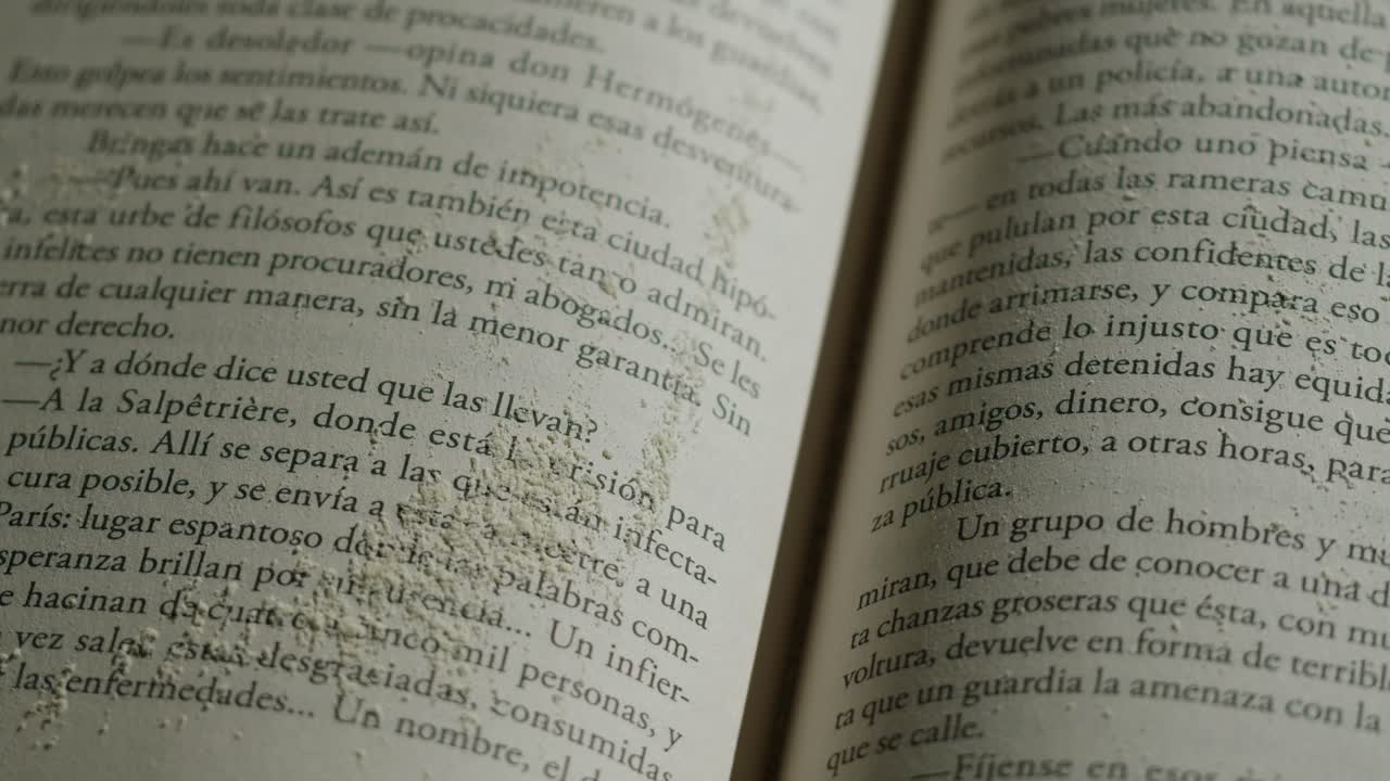 Close-up of book pages with dust