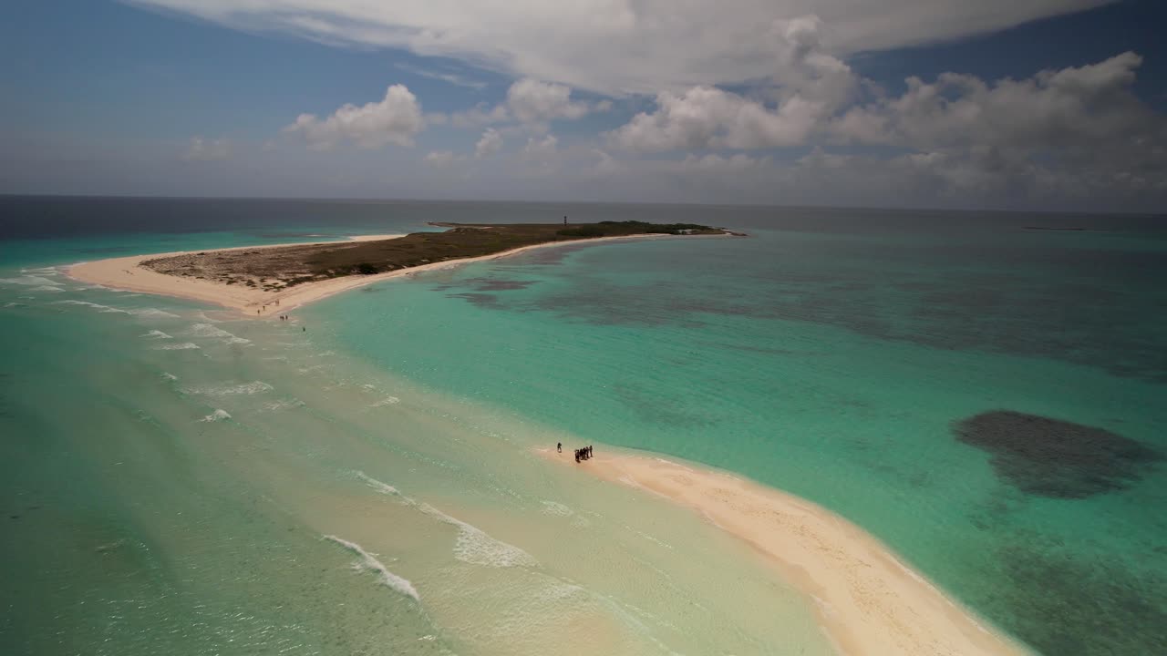 Aerial view zoom out group people enjoy day beach sandbar, Los Roques Venezuela